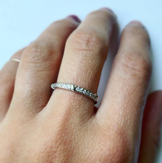 Karen Karch Platinum Colorless Diamond-Studded Eterity Band on a hand