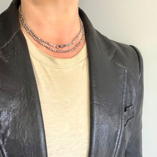 Karen Karch 32" Gray Diamond-stuuded Hooked Lithe with medium silver hook clasp on irregular silver beads shown doubled on neck, clasp centered. 