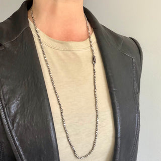 Karen Karch 32" Gray Diamond-stuuded Hooked Lithe with medium silver hook clasp on irregular silver beads shown long on neck.