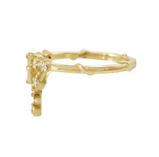 Karen Karch 18k Yellow Gold Diamond Tokyo Floating Star Ring side view with Baguette Diamond Center Stone and Princess Cut  Diamond in Cluster Shape    on a white bacground.