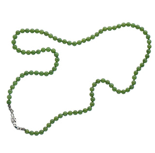A green jade beaded necklace with a silver logo'd tag displayed on a clean white background.