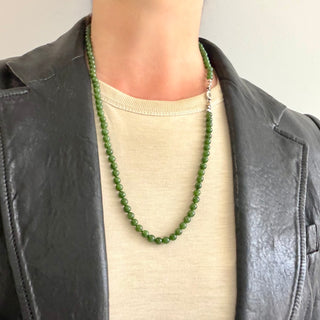Karen Karch Epitome 5mm Jade Bead Necklace shown on a person with a t-shirt and leather jacket. 