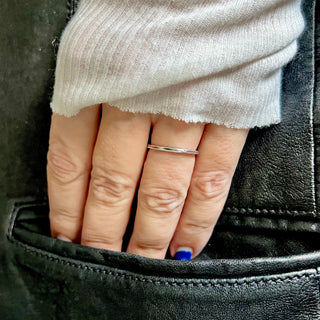 Karen Karch Everlasting 1.5mm wide weathered Silver ring on a hand