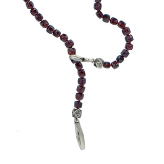 Karen Karch Garnet Faceted Square Bead Necklace close up of aweathered silver Bar and ploop ull through clasp on a white background