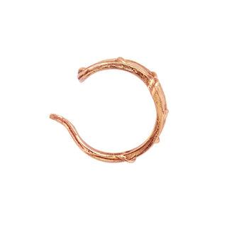 Overhead view of Karen Karch 10k Rose Gold Fishnet Ear Cuff on white background.