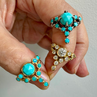 Karen Karch Comparison of 3 Floating Star rings, One Turquoise in silver, One Diamond in 18k yellow gold and One Turquoise set in 1k Yellow Gold.