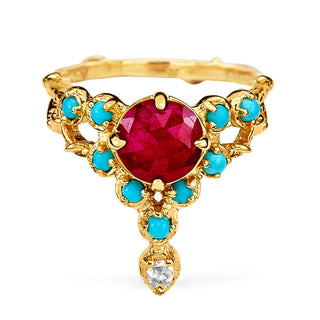 Karen Karch Floating Star yellow gold ring featuring an 8mm rose cut ruby center surrounded by 2.3mm cabochon turquoise, and a diamond in a tiara ring on a white background. 