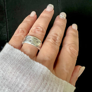 Karen Karch wide Silver Glisten band on a hand