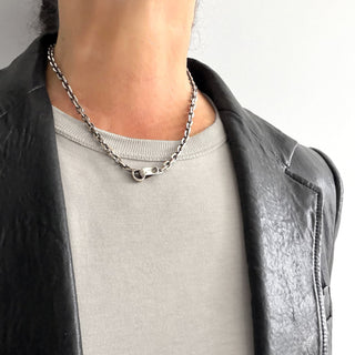 Karen Karch Sterling Silver Hooked Chain Necklace, clasp centered on a person.