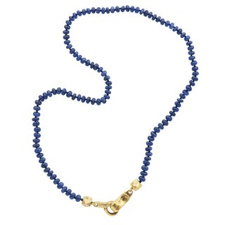 A Karen Karch Blue Sapphire beaded necklace with a 10k yellow gold weathered clasp on a white background.