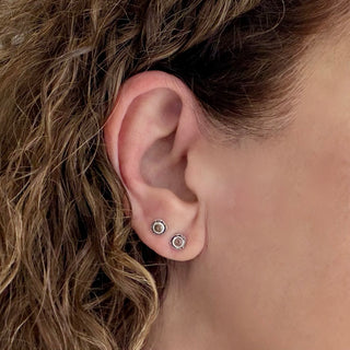 Karen Karch Silver Inner Circle bezel-set Natural Brown Diamonds Studs on an Ear.