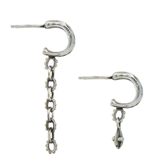 Side view of a pair of Karen Karch Jaipir Mainstay Silver mismatched hoop earrings, one with a chain and drop and the other with a drop on a white background
