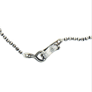 Karen Karch Round Silver Bead 32" Necklace close up of oversized clasp on white background.