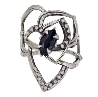 Karen Karch Silver Rose Tattoo Outline Ring with ball details and a dark blue sapphire center stone held by 4 claws on a white background.