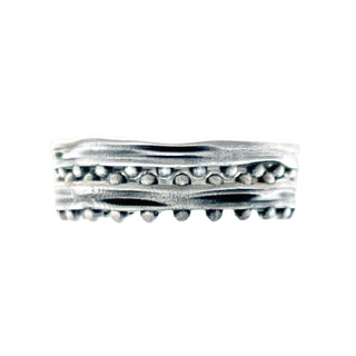 Karen Karch Jaipur Swing and Sway Silver textured ring with repeating ball details stacked together on one side on white background. 
