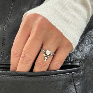 Karen Karch by Deme Wolfe Silver Landslide ring or connected angular shapes on hand.
