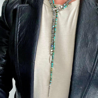 A multi-colored turquoise heishi bead lariat with a Labradorite lariat with weathered texture closure by Karen Karch
