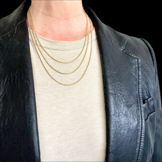 Karen Karch by Deme Wolfe Mystical Bling gold-filled chain necklaces featuring two different chain styles merged in 3 lengths on a person