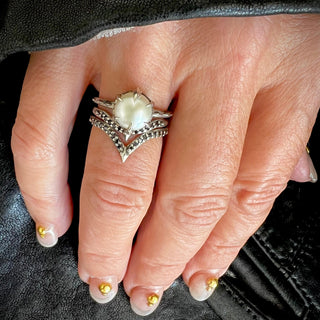 Karen Karch by Deme Wolfe white Pearl 925 sterling silver Solitaire Ring with Sharp claws on hand stacked with Black Diamond-studded Silver Bands
