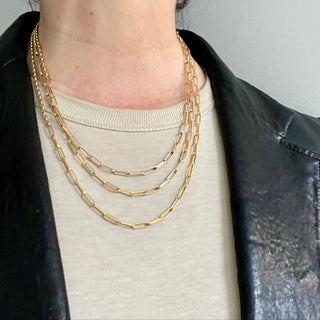 Karen Karch by Deme Wolfe Yellow Gold Filled 2 types of chain together to make necklace in 3 lengths close up on the neck
