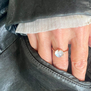 Karen Karch by Deme Wolfe 10k Rose Gold Mystical Solitaire 9mm Rainbow Moonstone Ring on hand