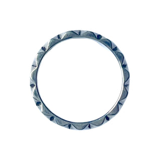 Karen Karch Outshine 3.8mm polished silver band with a repeated angular pattern, top view.