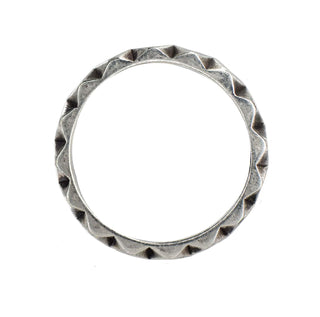 Karen Karch Outshine Weathered 4mm silver band with a textured, angular repeating pattern design , top view, on white background.