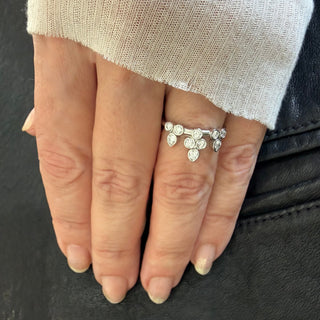 Karen Karch Platinum Bezel-set Diamond Belgian Tiara Ring with 8 round diamonds configured in the shape of a tiara with 3 pear shape settings at  the top row on a  hand
