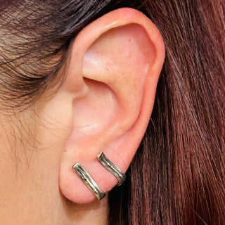 Karen Karch Pair of Sterling Silver Vine Tattoo Weathered curved Bar earrings paired together on one ear