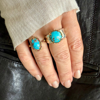 Karen Karch Matrix Persian Turquoise Mixed Metal Rings on a hand.