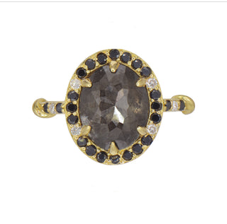 Karen Karch 18k Yellow Gold Dark Grey Oval Diamond ring surrounded by a order of black and white diamonds. There are 3 diamonds each side of center on the band.  
