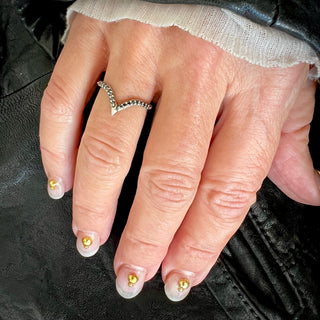 Karen Karch by Deme Wolfe Royal Dune Ring in silver with black diamond on front of band on a hand