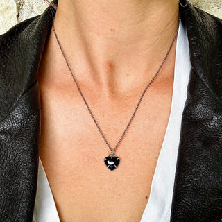 Karen Karch by Deme Wolfe magical Heart Silver Black Onyx on Chain on Person in Leather Jacket