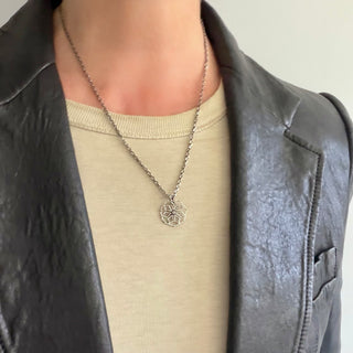 Karen Karch Silver Desert Flower Diamond centered Pendant with Vine details on a neck