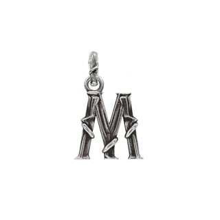 Karen Karch textured silver charm in the shape of the letter 'M' with a vine-detail and rectangular bail on white background.