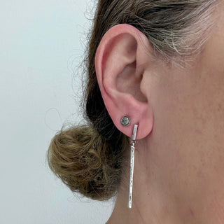 Karen Karch textured silver Inner Circle Salt & Pepper Grey diamond stud shown on ear with Silver Blade Runner.