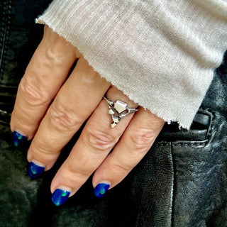Karen Karch by Deme Wolfe Silver Landslide ring or connected angular shapes on hand.