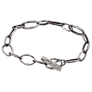 Karen Karch Silver Weathered Outshine Toggle Oval Link bracelet on white