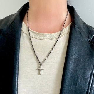 Person wearing a Karen Karch Unearthed Cross Amulet on a 2.6mm Diamond Cut Cable Chain.