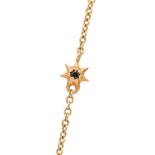Karen Karch Yellow Gold Chain Necklace with Rose Gold Star With Black Diamond Center on White Background, close up of star