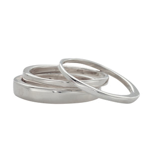 Karen Karch smooth irregular polished Always 3-ring stack on a white background.