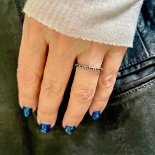 Karen Karch Silver Jaipur Evermore Half Eternity band Alternating Blue Sapphire and Black Diamond on a hand.