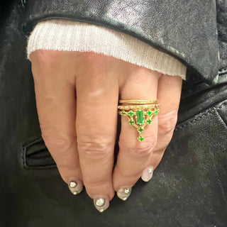Karen Karch Yellow Gold Emerald Tokyo Floating Star Ring on hand stacked with 2 thin gold bands
