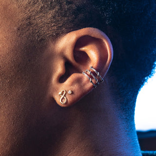 Karen Karch blackened silver ear cuff featuring three rows of textured twining vines styled on the ear ith sanke stud