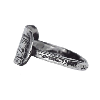 Karen Karch Unearthed Silver Tag Ring with a heavily textured design, side view,  on a white background.