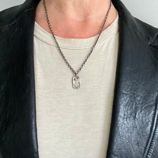 Karen Karch Small  Silver unearthed Dog Tag on chain on model in black leather jacket