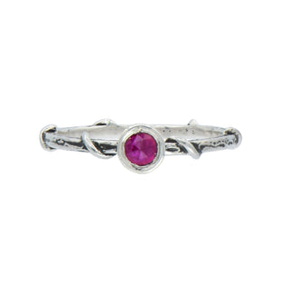 Karen Karch Silver Vine Stacker with a bezel-set ruby on a white background.