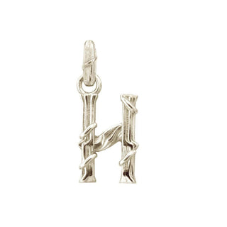 Karen Karch textured white gold charm in the shape of the letter 'H' with a vine-detail and rectangular bail on white background.