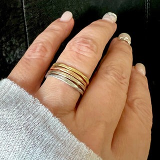Karen Karch Willow Weathered Irregular edge 18k yellow gold, 18k rose gold, 18k white gold and platinum bands on hand.