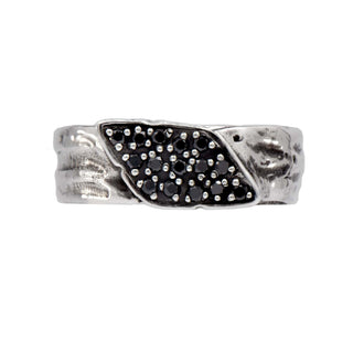 Karen Karch silver Signet Wrap ring studded with black diamonds on white background.